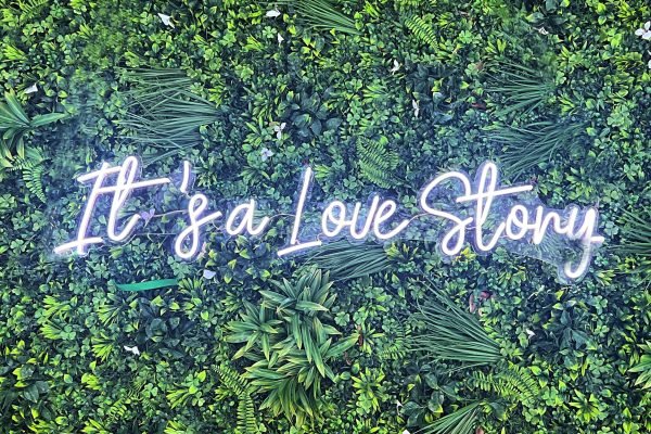 neon sign its a love story